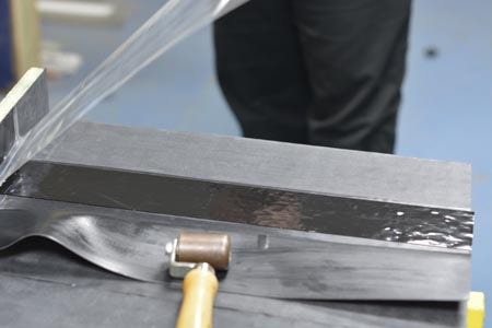 Removing the plastic from the seam tape