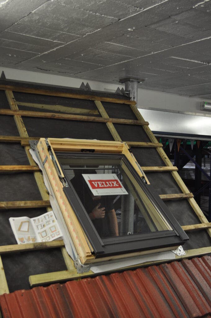A Velux Centre Pivot Roof Window being installed at JJ Roofing Supplies