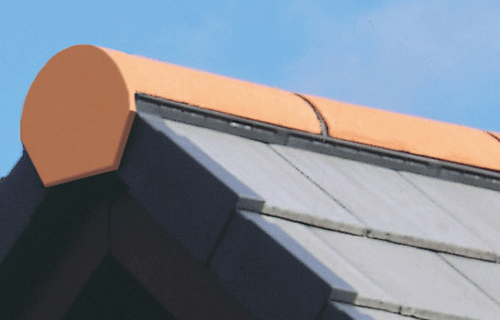 half round ridge tiles on a slate roof