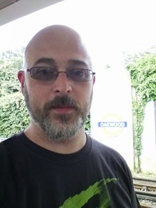 A tired tech addict waits at the train station early on a weekend morning just to try on Google Glass