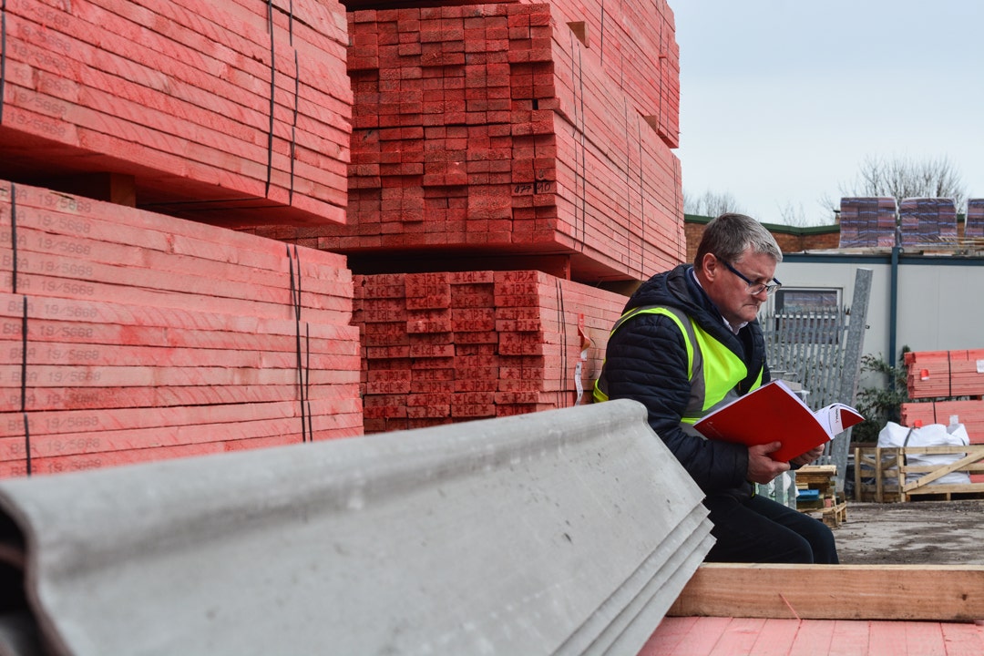 Steve sitting reading his favourite roofing literature, the Marley Roof System Specification Guide