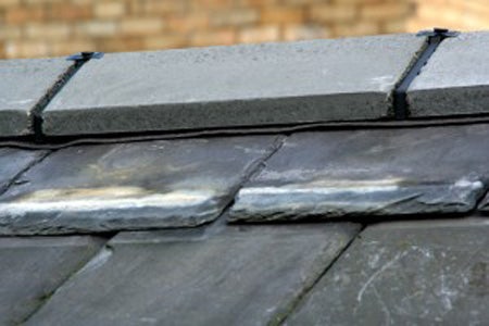 Ridge tiles on a natural slate roof