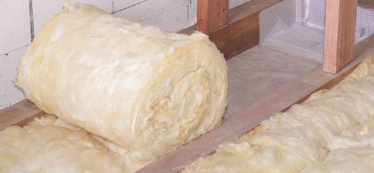 Roll of loft insulation on the loft floor