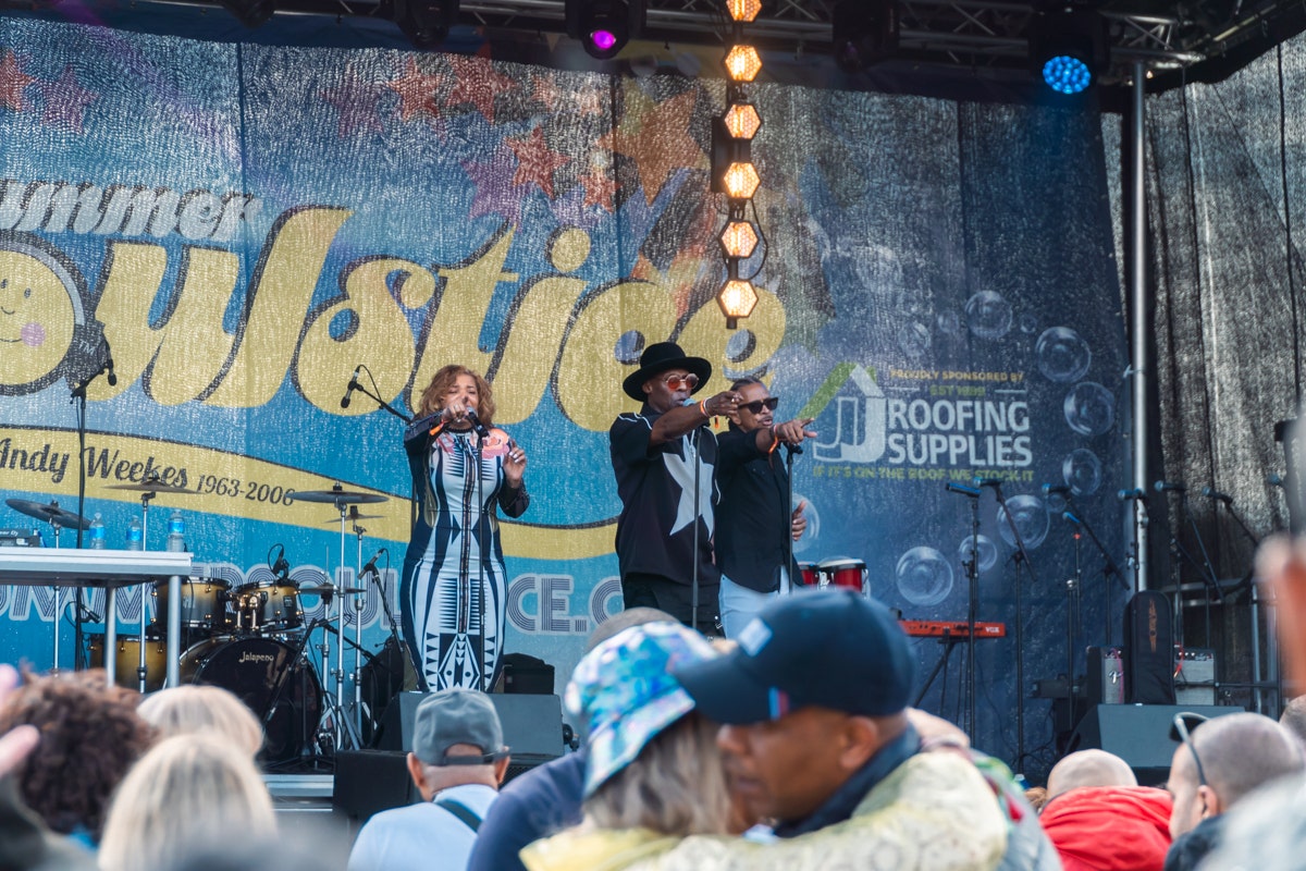 Loose Ends Summer Soulstice 2024 performing Hangin' On A String flanked by JJ Roofing Supplies