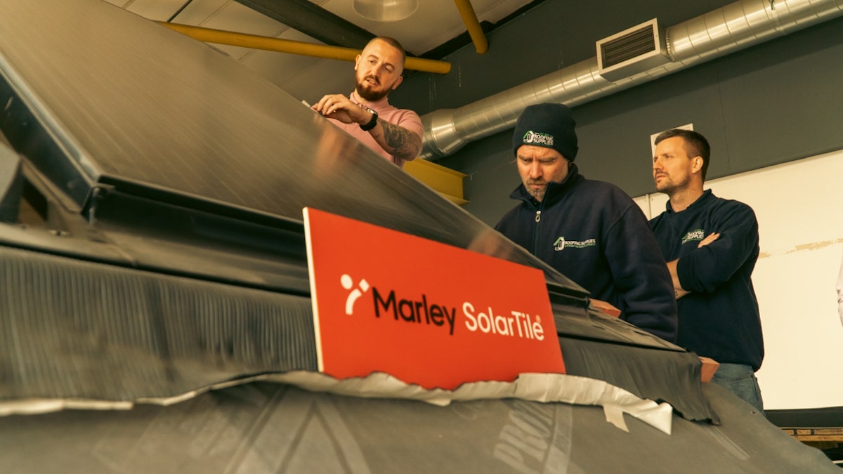 Marley SolarTile panel installation being demonstrated by Tim Nicoll to JJ Roofing Supplies Staff