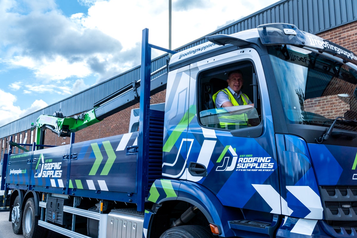 JJ Roofing Supplies Mercedes Crane Dropside 2023 with Transport Manager Carl Jones in the cab