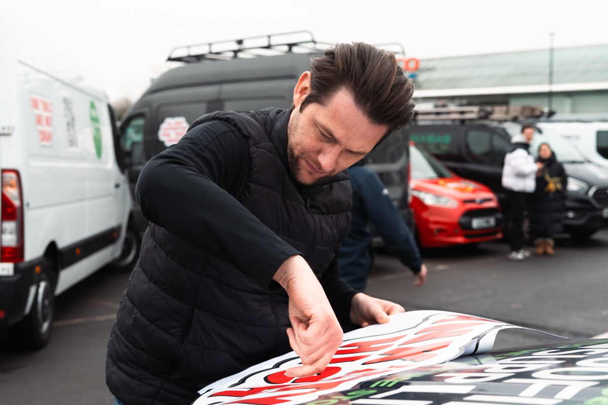 Steven Parker applying Stop Tool Theft Stickers to his JJRS Ranger