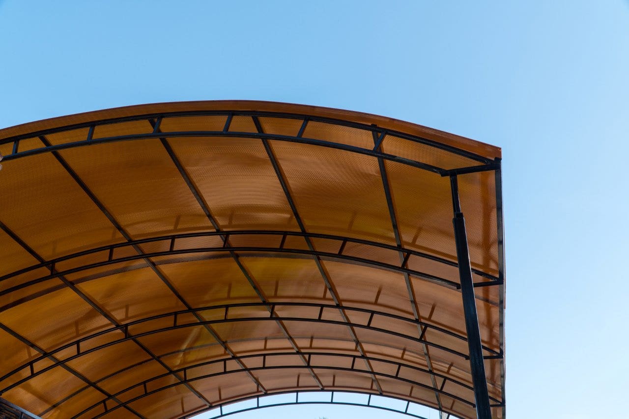 car port with polycarbonate roof installed
