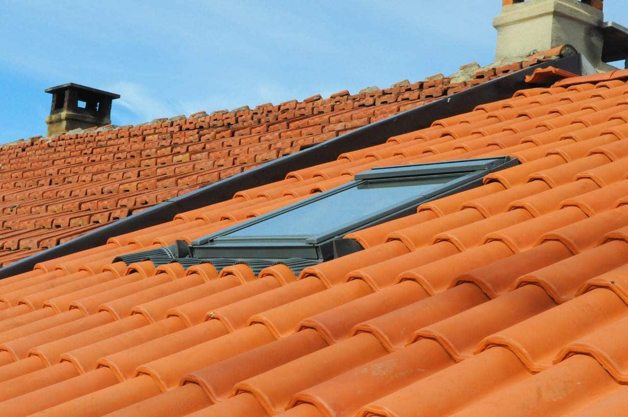 Clay roof tiles and roof window